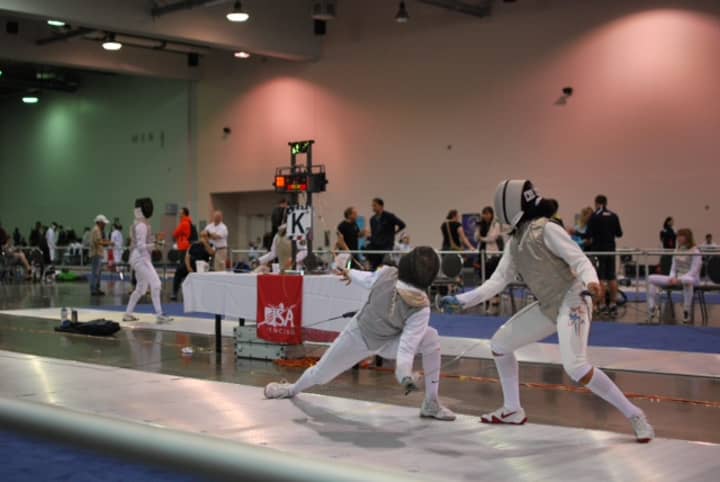 Sylvie Binder, left, is pictured fencing Iman Blow of New York City in the finals of the Womens Junior team competition.