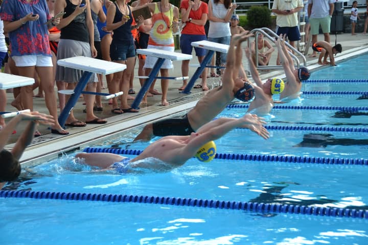 Chappaqua and Briarcliff swimmers take off in a race during a dual meet July 8.