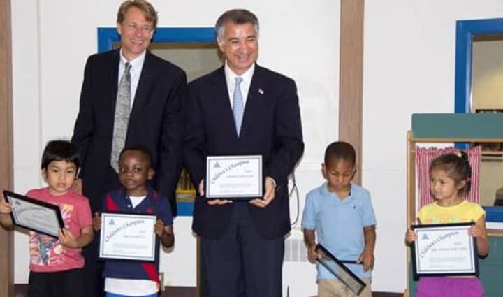 State Senator Carlo Leone (D-Stamford), center, pays a visit to the Palmer&#x27;s Hill Child Development Center in Stamford, where he was recognized as a Childrens Champion by the Connecticut Early Childhood Alliance.