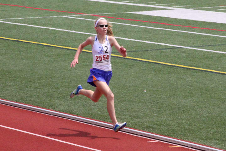 Angela Saidman of Wilton Running Club heads for victory in a race at the Junior Olympic Region 1 Track and Field Championships. Saidman won the 800 and 1,500. 