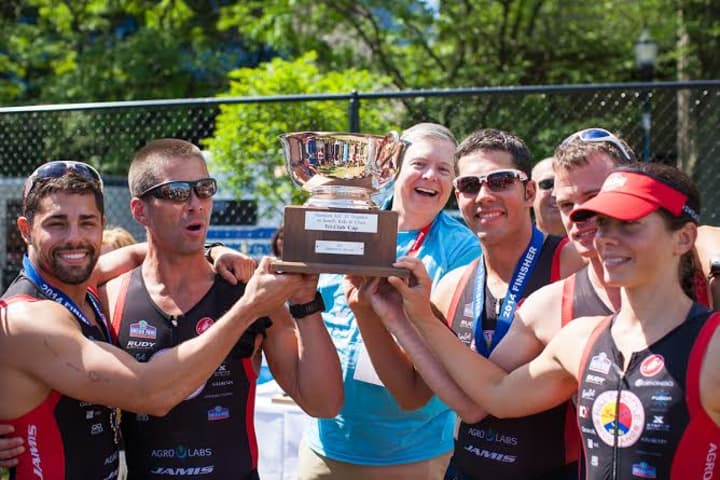 Triathletes from Chelsea Piers Connecticut in Stamford celebrate after a recent race.
