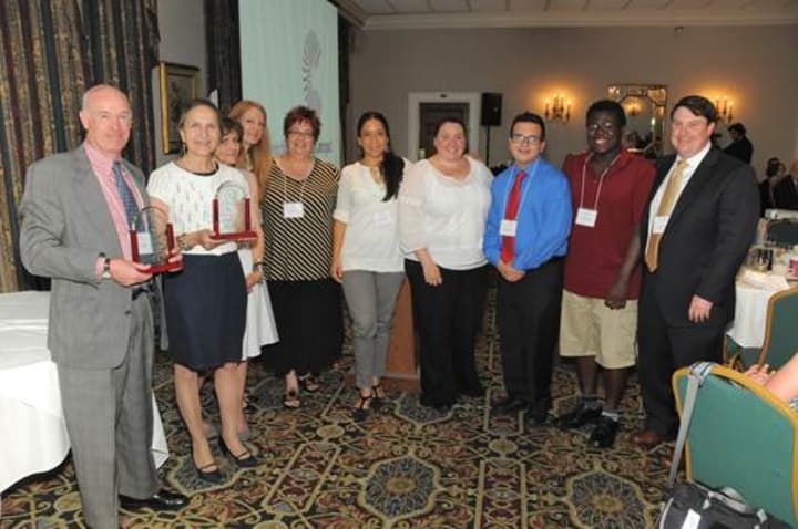 FCA President &amp; CEO Robert F. Cashel (far left) and NCC Provost and Dean of Academic Affairs Dr. Pamela Edington (second from left) with staff and students from FCA and NCC accepting the Campus-Community Partnership Award.