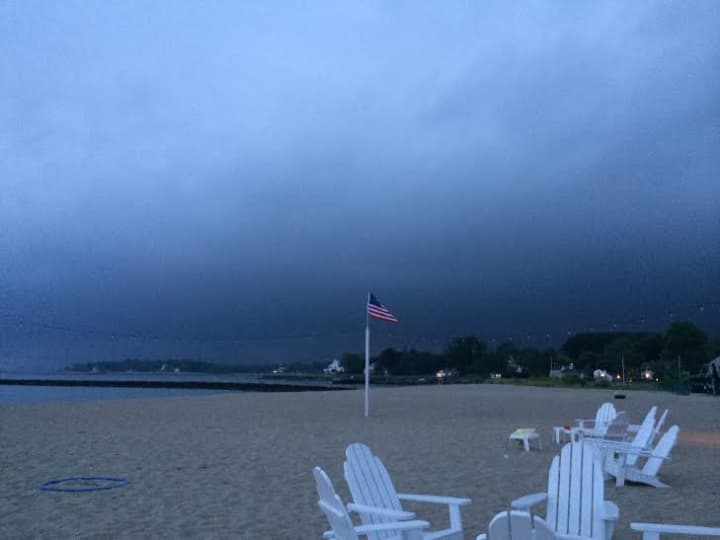 Dark clouds roll in over Southport Beach in Fairfield before a storm in July. 