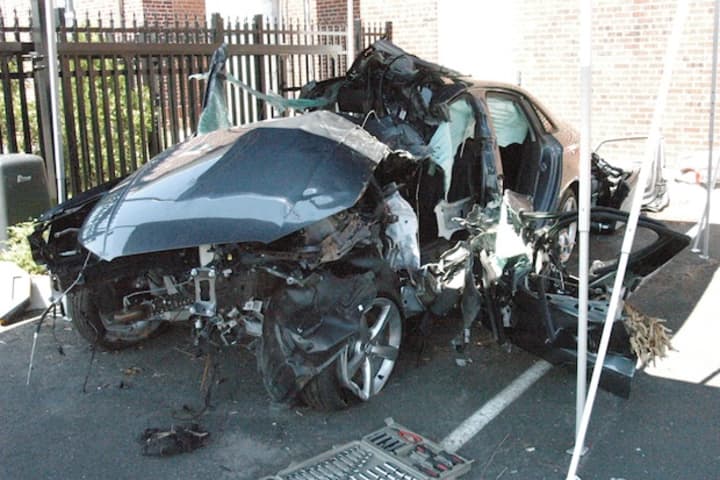 The wreckage of a 2015 Audi that was totaled in a June 9 crash which critically injured a 33 year-old Darien man.