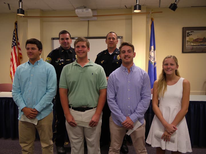 Christopher Rubis, Christopher Bodnar, Tyler Caruso and Erin Broderick all received $500 scholarships from the Fairfield Police Union, handed out by Lt. Keith Broderick and Chief Gary MacNamara.