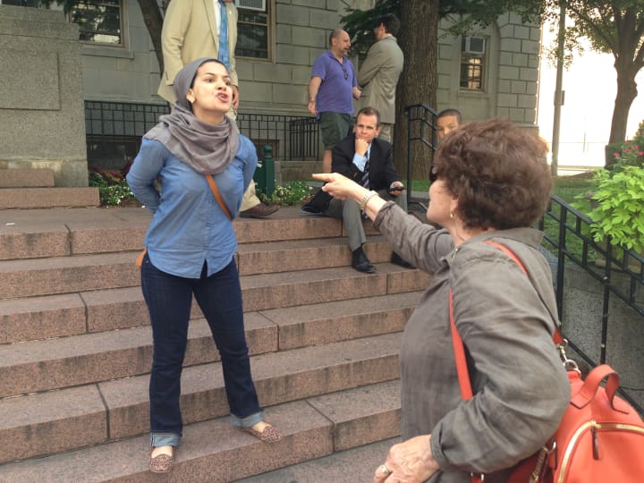 Several residents attending a pro-Israel rally in White Plains Thursday exchanged heated words with a woman protesting Israel. 