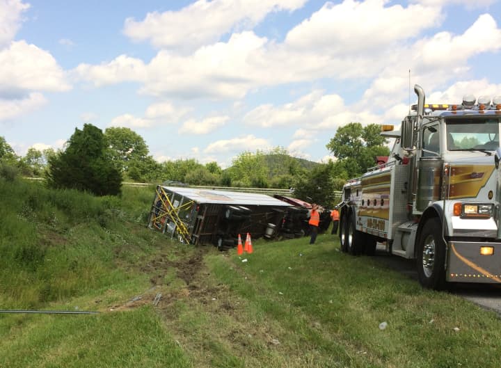 An overturned tractor trailer is about to be towed by Lisi&#x27;s Towing Company early Monday afternoon near the I-684/I-84 interchange in Brewster, N.Y.