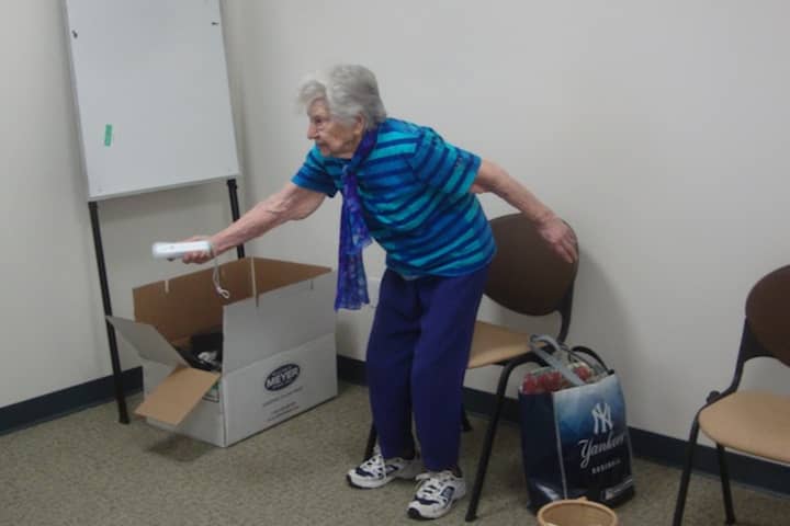 Darien senior plays Wii Bowling at the Mather Center. The senior center offers Bingo Friday, April 29 among a variety of upcoming programs.