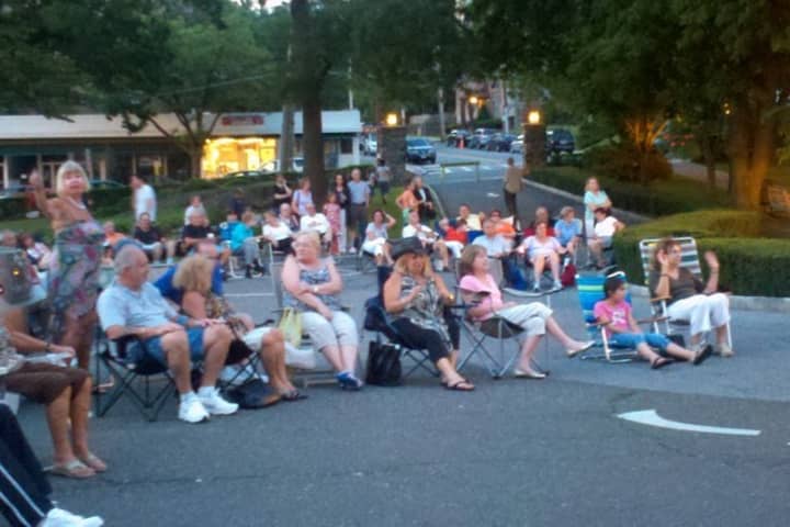 Eastchester residents enjoying a concert last year. The venue has changed, but the music stays the same. 