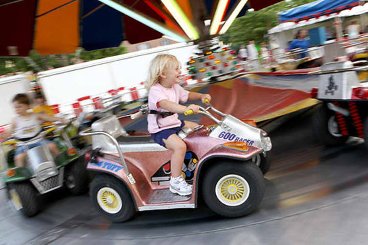Youngsters enjoy the ATV merry-go-round at the Eastern Volunteer Fire Department&#x27;s Carnival in 2010. 