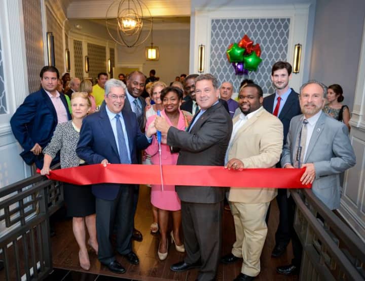 Yonkers officials, including state Sen. Andrea Stewart-Cousins, Mayor Mike Spano, Councilman Christopher Johnson and Minority Leader Michael Sabatino, welcome the new luxury apartment complex Library Lofts to the downtown waterfront district. 