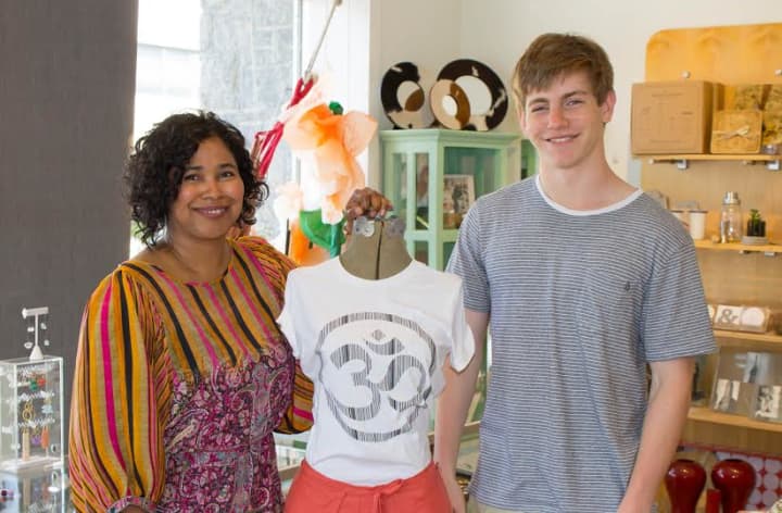 Dawn-Marie Manwaring, owner, Beehive Designer Collective, and Horace Greeley High School student and T-shirt designer Scott Silver. Silvers om shirt is being sold for $28 at the Beehive,  337 E. Main St., Mount Kisco.