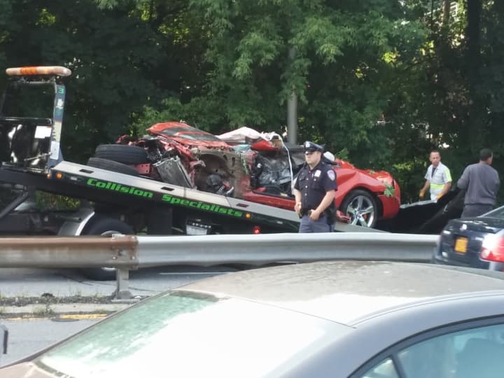 The vehicle involved in the fatal crash being placed on a tow truck Wednesday morning.