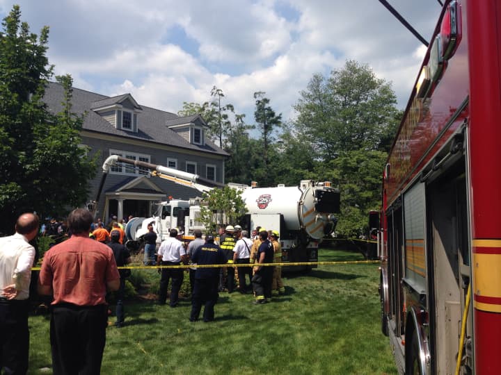 Emergency crews respond to 15 Bradford Ave., Rye, where two workers were trapped after a trench collapsed Thursday.