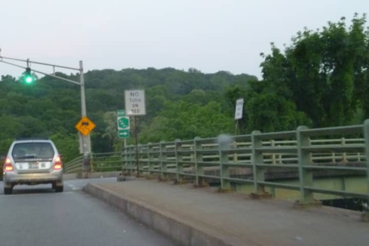 The Ashford Avenue Bridge will undergo repairs after a car crashed through a guard rail Wednesday, July 30.