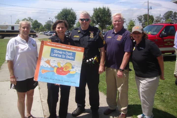 Pam Raila of the Norwalk Parks and Recreation Department, Deputy Police Chief Susan Zecca, Sgt. Terry Blake, Mark Blake of Safe Kids Connecticut and Doreen Miner of Stew Leonard III Children&#x27;s Charities at Calf Pasture Beach.