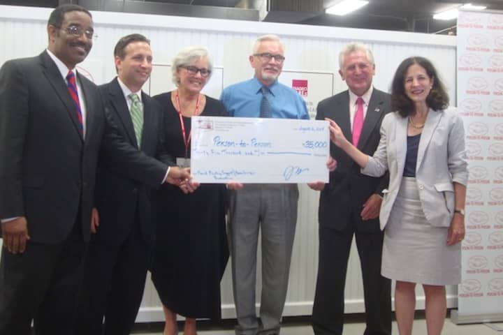 Rep. Bruce Morris, Sen. Bob Duff, Person-to-Person Executive Director Ceci Maher, CHEFA Executive Director Jeffrey Asher, Mayor Harry Rilling and Rep. Gail Lavielle celebrate CHEFA&#x27;s $35,000 grant to Person-to-Person in Norwalk.