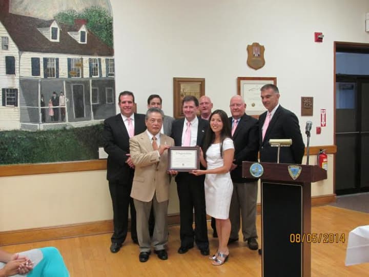 The Village Board of Trustees and Elmsford Mayor Robert Williams present Johshin Honzan, left front, and his World Seido Karate dojo with a declaration making Aug. 6 &quot;World Seido Karate Day&quot; in the village.