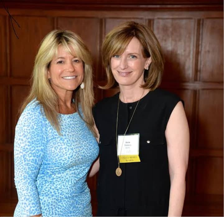 Anne Sweeney, right, received the Angela Merici Medal from Judith Huntington, left, president of The College of New Rochelle. 