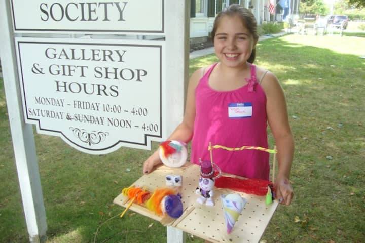 Noelle DeFelice displays the miniature circus she made at the workshop at the Westport Historical Society.
