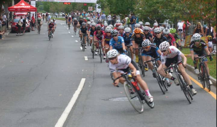 Women riders at a turn during the Danbury Audi Race4Scholars Criterium amateur and professional bicycle races in downtown Danbury on Sunday. It was held on a 1-kilometer course.