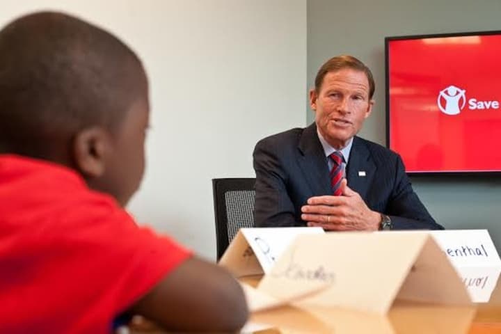 Sen. Richard Blumenthal answers a question from Sebastian Nicolas, 7, of Bridgeport, as part of a kids roundtable during his visit to Save the Children USA headquarters in Fairfield on Wednesday.