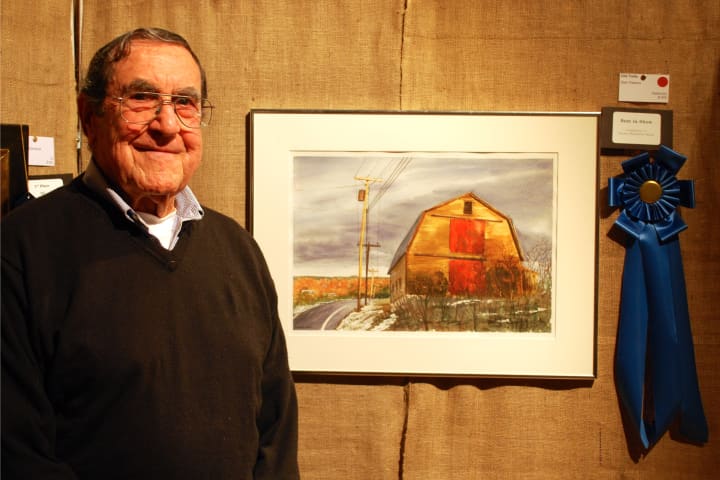 Stan Pastore with his watercolor painting, &#x27;Old Yella,&#x27; which won Best in Show at the 56th Annual Darien Art Show and Sale at the Darien Arts Center.