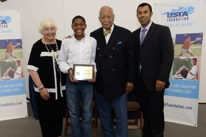 From left to right: Barbara Wynn, Arthur Ashe Essay Contest Founder; Torianh Blakes, boys 11-12 winner; David Dinkins, former Mayor of New York City; and Dan Limbago, USTA Foundation Programs &amp; Services National Manager. 