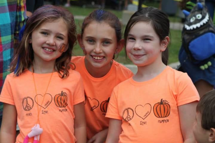 Girls enjoy the Tokeneke Pumpkin Carnival in Darien in 2013.