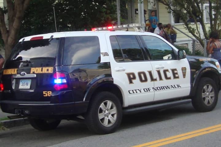 Norwalk police arrested a 23-year-old man after they said he hit a pedestrian with his car Thursday night.