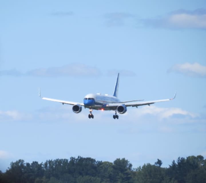 Air Force One descending on Westchester County Airport during its first landing there in a 28-hour time span on Friday.
