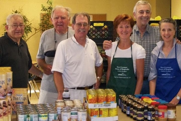 Volunteers at New Covenant House serve food to hungry people in Stamford. The fourth annual Harvest Table to support New Covenant House will be held on Nov. 2 at The Country Club of Darien. 