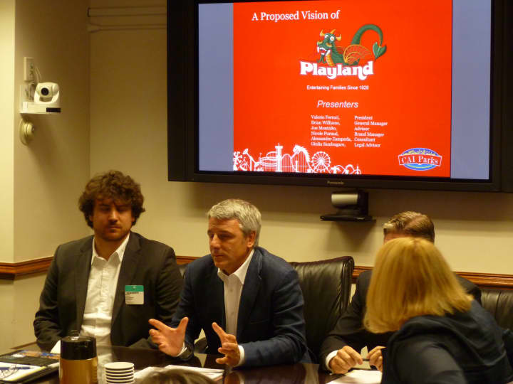 Valerio Ferrari (center) talks about Central Amusements International&#x27;s plan for Playland. 