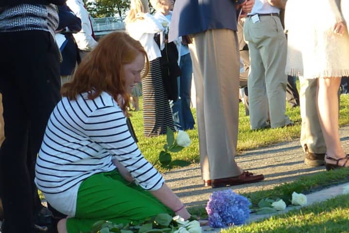 Family and friends of people who died in the Sept. 11, 2001, terrorist attacks gather at the state&#x27;s 9/11 Memorial at Sherwood Island State Park in Westport during a past ceremony. 