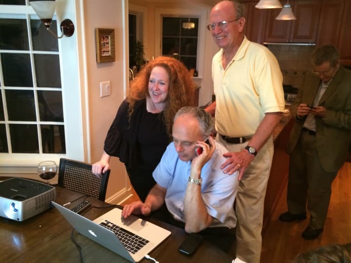 Leon Potok (center) calls in early returns in the Democratic Primary for the Village of Mamaroneck Tuesday night. 