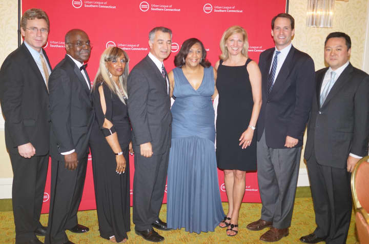 State Rep. Gerald Fox III, Tony Loney and wife Yvonne, State Sen. Carlo Leone, Valerie Shultz-Wilson (Urban League of Southern Connecticut), Kristen Roberts (Comcast), U.S. Congressman Jim Himes and State Rep. William Tong attended a recent dinner.