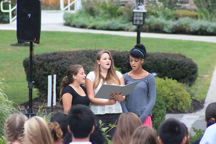Wooster School girls sing the National Anthem at the 9/11 ceremony in Danbury on Thursday morning. 