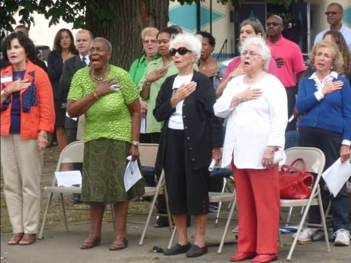 Attendees at a 9/11 Memorial event at Jackie Robinson Park in Stamford sing the &quot;Star Spangled Banner.&quot;