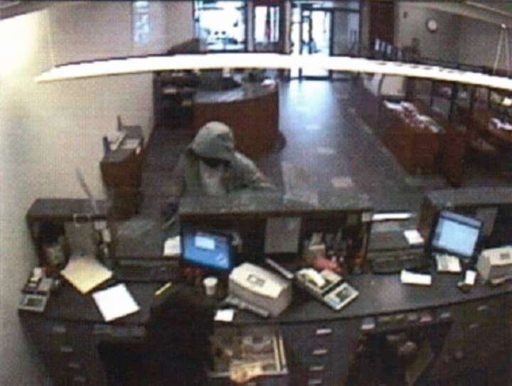 Surveillance footage of the bank robbery suspect at the counter of the Hudson United Bank on Westport Avenue in Norwalk.
