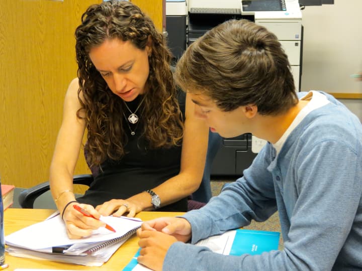 English teacher Samantha Fishman works with Briarcliff High School senior David Kaminsky on a college essay in the schools writing lab.
