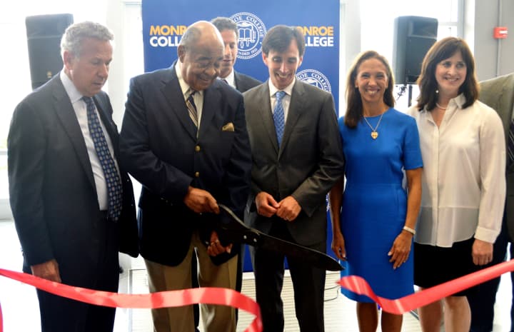 Dr. James Gaddy (second from left) with several New Rochelle dignitaries cutting the ribbon to the dorm room bearing his name.