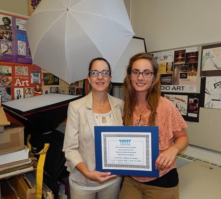 Beth Gruber (left) of the Hendrick Hudson Community Educational Foundation  presents a classroom certificate to Jessica Nash.