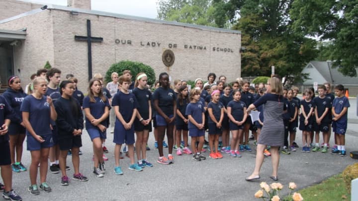 Students gather at the Our Lady of Fatima School&#x27;s 9/11 Memorial Service. There will be an Open House next weekend for prospective students and their families.
