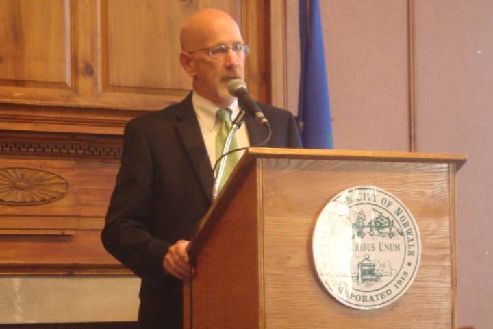 Jeff Bean of the U.S. Conference of Mayors addresses small business owners at a seminar hosted at Norwalk City Hall.