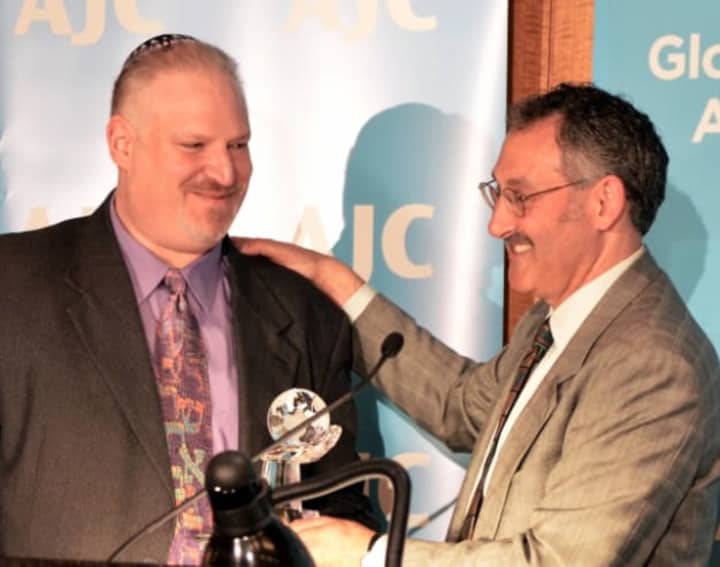 Rabbi Mitchell Hurvitz, of Temple Sholom in Greenwich, left, accepts an award at the AJC Westchester Gala on May 28. 
