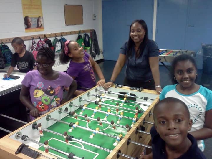 New Remington Clubhouse Director Kandece Francis with several youths at the New Rochelle Boys and Girls Club. 