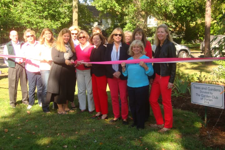 Members of the Garden Club of Darien and town officials cut the ribbon for the new garden and trees planted at Cherry Lawn Park.