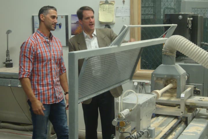 Peter Tucci of Tucci Lumber Co. in Norwalk gives U.S. Rep. Jim Himes a tour of the facility where he makes 16,000 baseball bats per year.