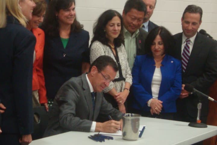Gov. Dannel P. Malloy signs a new law into place that will aim to reduce concussions in student athletes.