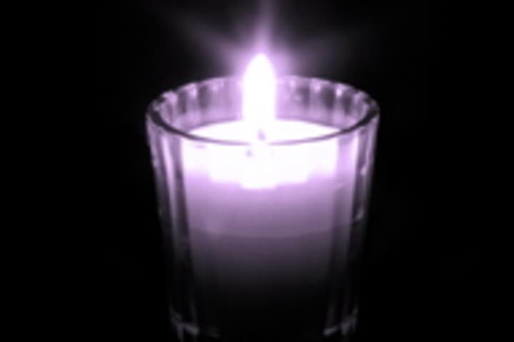 Remember the victims of domestic violence at a candlelight vigil in October. 